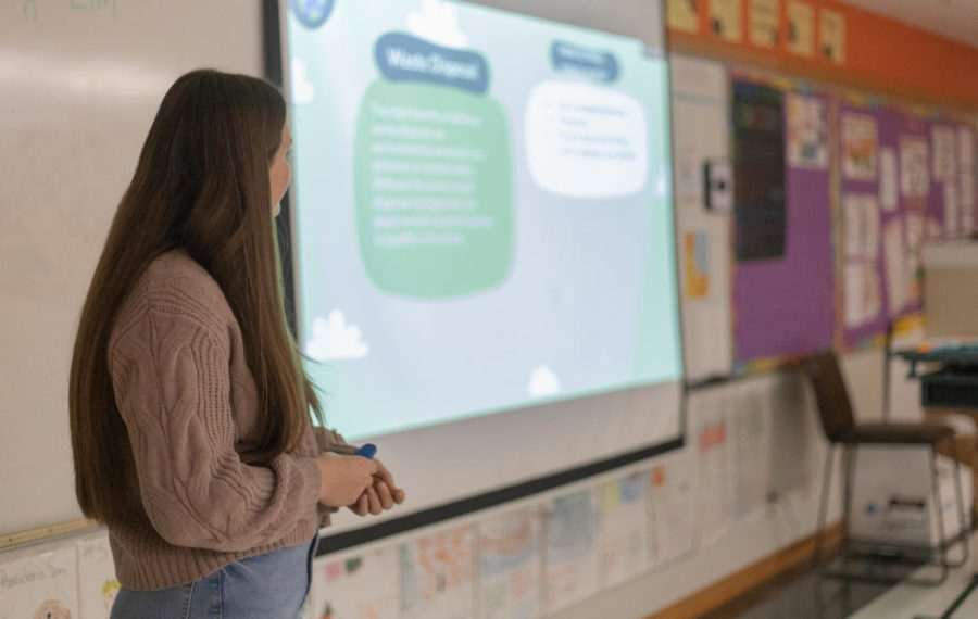 Senior Joli Icenhower stands in front of the class to give a presentation in Mrs. Mooneyhams Composition class.