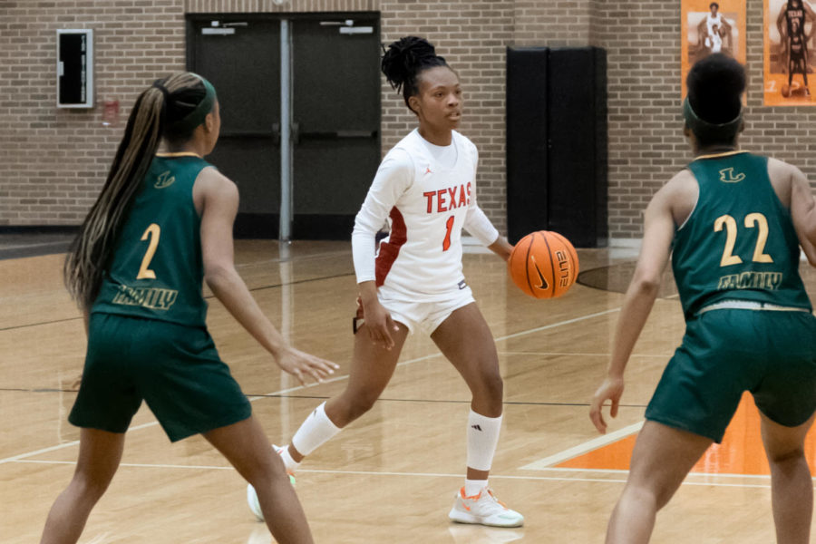 Texas Highs Ashanti Northcross looks over the Longview defense in the second quarter of the game at the Tiger Center on Jan. 28, 2022. The Lady Tigers defeated the Lady Lobos 43-20.