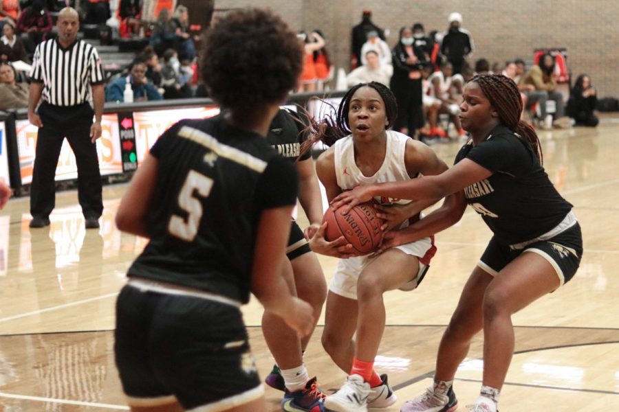 Texas Highs Delayna Augustus struggles against the Mt. Pleasant defense on Jan. 7, 2022. The Lady Tigers of Mt. Pleasant gave Texas High their first district loss of the season.