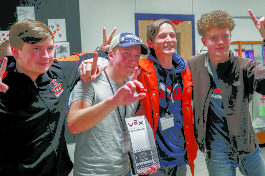 The finals trophy is claimed by sophomores Brett Sparks and Gavin Smith, senior Peyton Philyaw and sophomore Aidan Spivey, members of the AllSpark team, at the 67 Classic VRC Tournament held Jan. 29 at Texas Middle School. This is the first time a Texas High team has been awarded this.