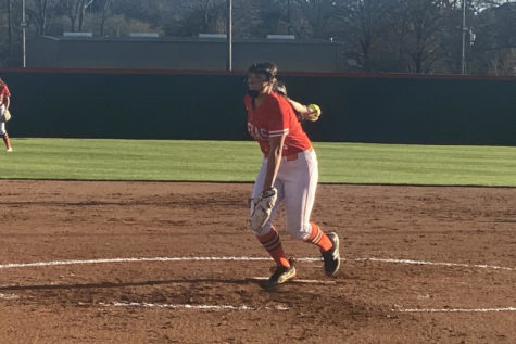Senior Lizzie Smith delivers a pitch to opposing batters of the Pine Tree softball team. Smith struck out 11 batters in the Tigers game against the Pirates at Texas High on March 16, 2022.