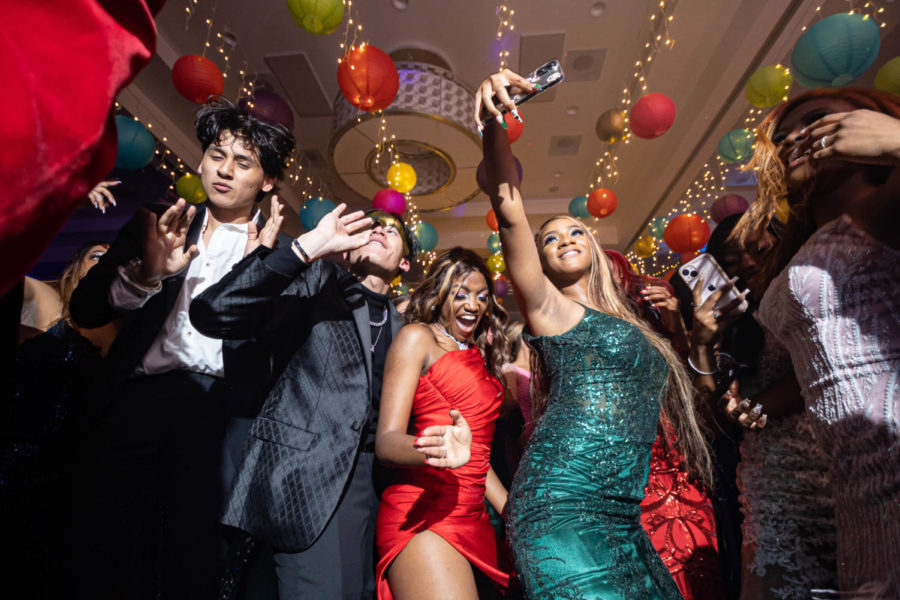 Senior Talisha Goldstien dances while her friend takes a selfie. Texarkana Convention Center hosted the Texas High School Prom of 2022. 