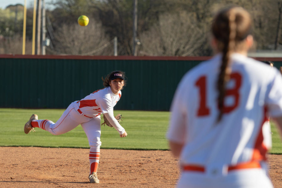 Senior Lauren Allred makes a play from shortstop to first base in varsity softball game. Allreds ability to be a utility player aided her in landing scholarship opportunities. 