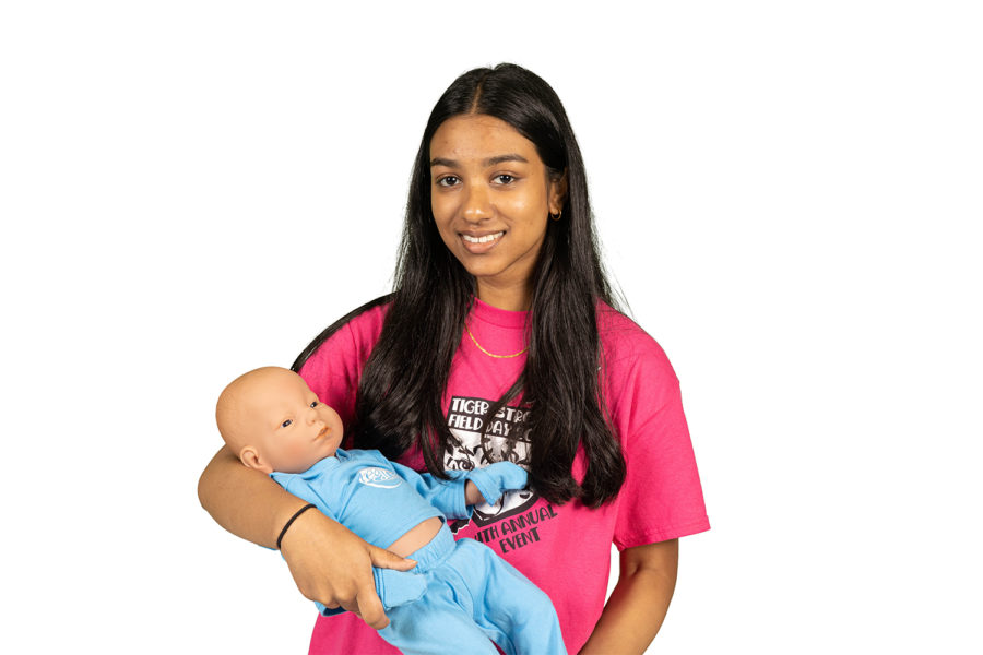 Sophomore Nashita Kalam comforts her robotic baby for her child development class. During this project, she discovered the struggles behind motherhood.