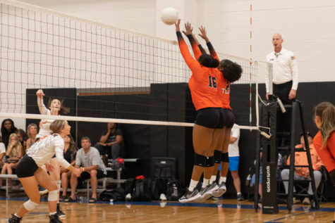 Tigers Kiara Martin and Kyleigh Perkins set a block in the game against Gilmer in the Tyler Volleyball Tournament on Aug. 12, 2022. 