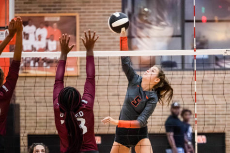 Junior Mally Lumpkin spikes the ball against the Atlanta defenders for one of her 14 kills in the match with Atlanta High School. The Tigers won their season opener in straight sets (27-25, 25-19, 28-26) in the Tiger Center against Atlanta High School Rabbits on Aug. 9, 2022.