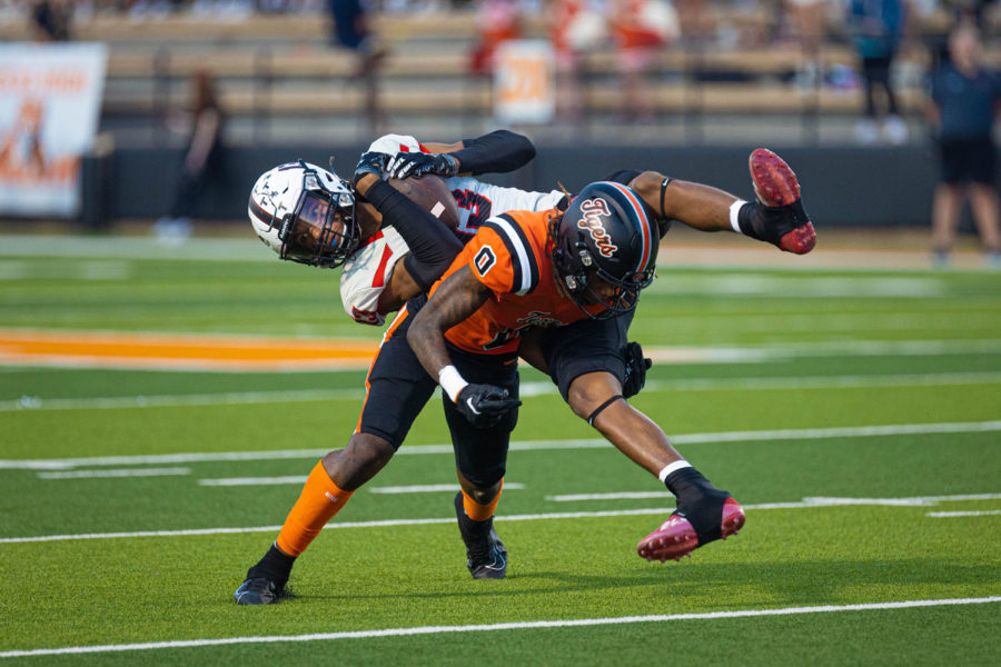 Defensive Back CJ Brown takes out the legs of a Tyler Legacy receiver in the first quarter of the match up between the Lions and the Tigers. The score at the end of the first quarter was 7-3 setting up the Tigers for a win.