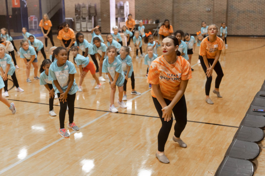 Junior lieutenant Liberty Cowan teaches the Future HighSteppers their dance routine for their upcoming performance. The Future HighSteppers will dance at Tiger Stadium on Sept. 16, 2022 before kickoff.