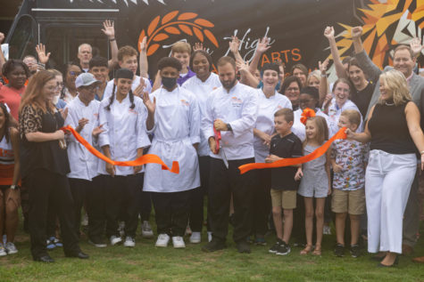 Students, staff and community celebrate as Culinary Arts Academy instructor Chef Cory House cuts a ribbon in honor of the programs new food truck. Students served food prepared in the new kitchen on wheels to attendees of the event on Sept. 1, 2022.