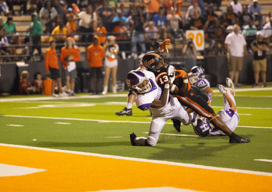 Wide Receiver Brandon Hall leans into the end-zone on September 23, 2022. The Texas High Tigers defeated the Hallsville Bobcats 56-31 in the district season opener. 