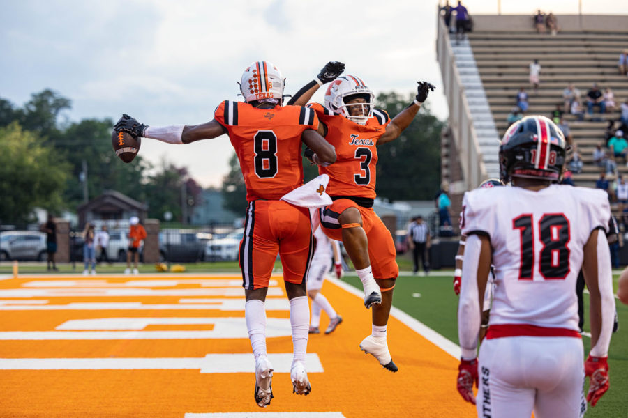 Xavier Dangerfield and Trent Kelly jump in celebration after Dangerfield scores a touchdown. The Texas High Tigers defeated the Colleyville Heritage Panthers 48-23 in their second preseason game of the year, Sept. 2, 2022.