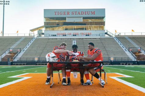 Senior offensive linemen Briley Barron, Richard Jackson and John Jack eat pancakes in the center of Tiger Stadium. The Tigers play the Hallsville Bobcats at home on Sep 23, 2022 at 7 p.m.