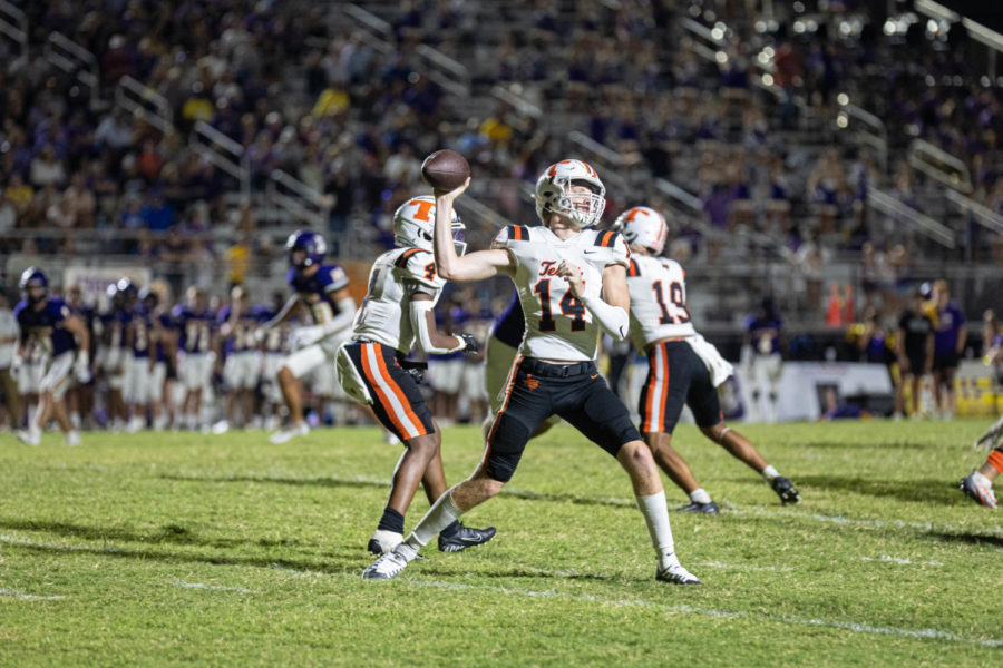 Sophomore David Potter throws a pass in his first varsity game against Benton after the injury of senior quarterback Cody Reese. The Tigers defeated Benton 46-35 Friday, Sept 9,2022.
