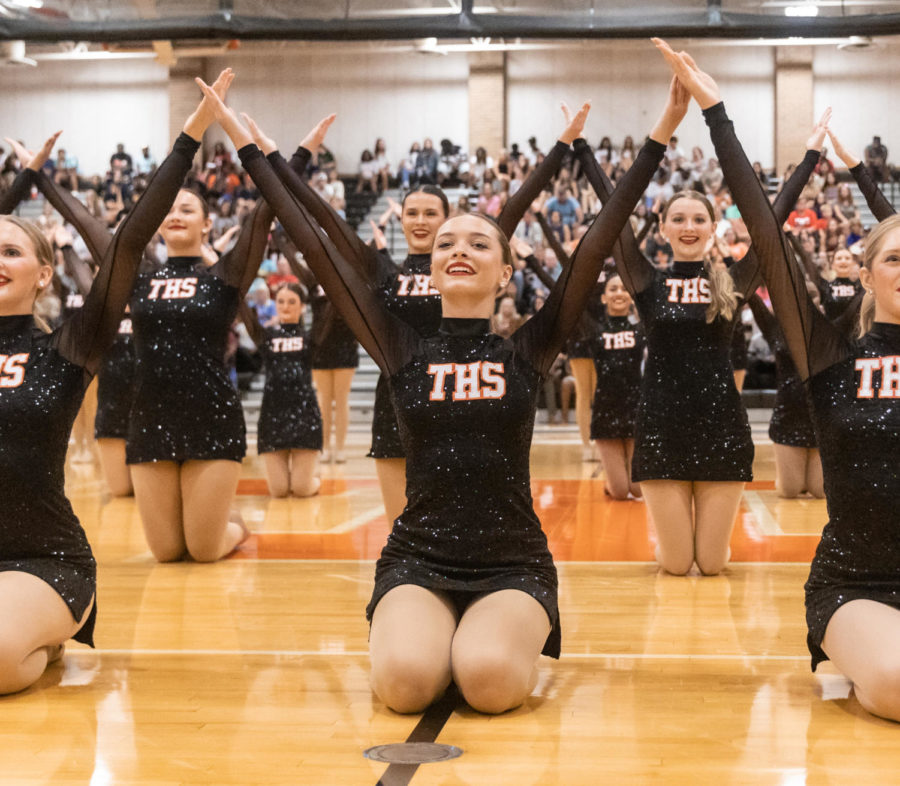 Senior Lizzie Debenport smiles at the crowd at the end of their dance. The HighSteppers perform a routine to September by Earth, Wind & Fire at the Watermelon Supper every year.