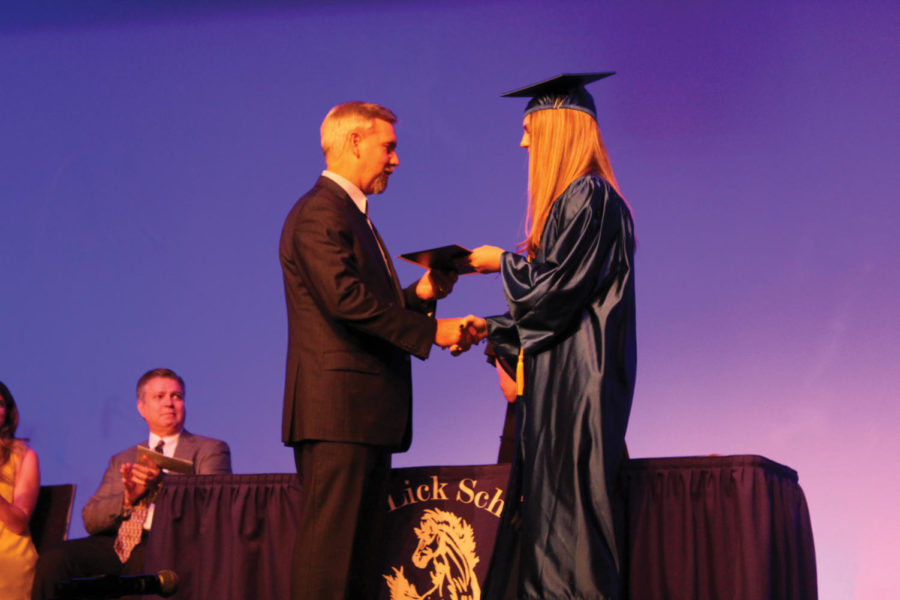 Sophomore Anna Haley accepts her diploma at her eighth grade graduation. It is finally time to move from Red Lick to Texas High School.