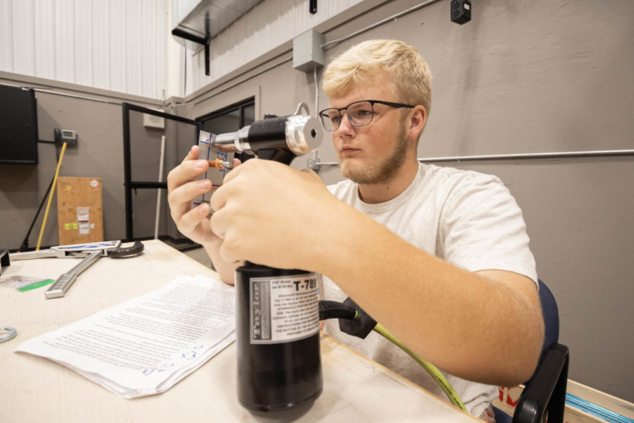 Junior Evan Sutton works on the beginnings of the flight class plane. The Tango Flight class will be spending the next two years building a plane from the ground up.