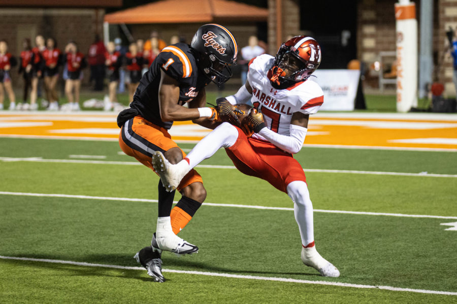 T.J. Gray fights for the ball against a Marshall Maverick on Oct. 14, 2022 at Tiger Stadium. The Tigers improve their district record to 3-0 with a victory over the Mavericks.