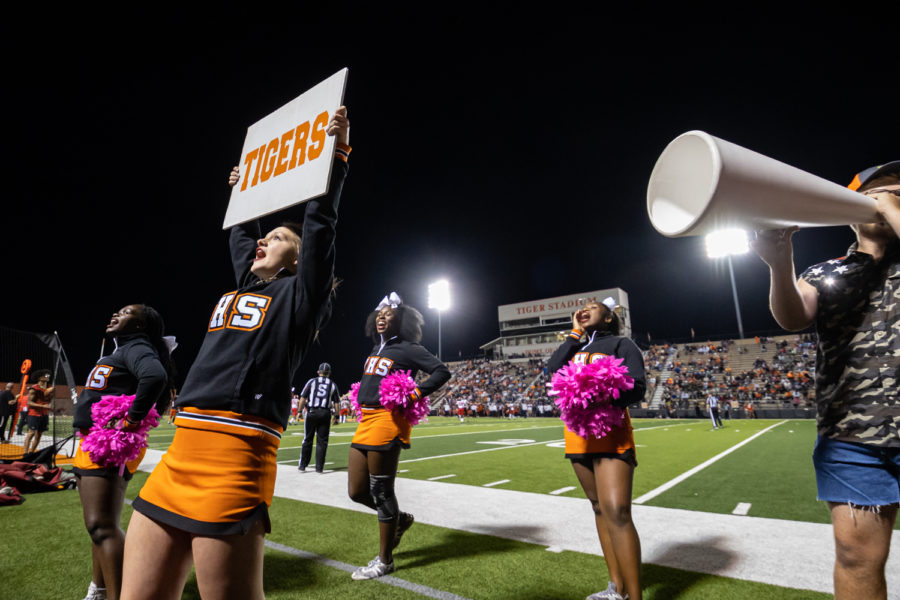 From the sidelines, cheerleaders yell to the student section during the Texas versus Marshall district game. The Tigers defeated the Mavericks 42-35.