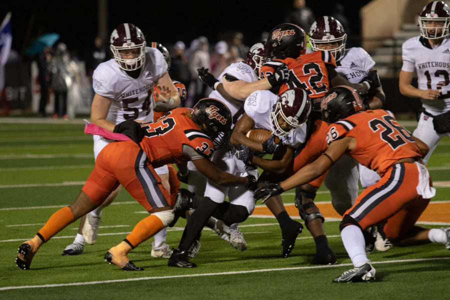 The Texas High football team collectively fought to stop an opposing player from heading towards the end-zone during the Texas versus Whitehouse football game. The Wildcats defeated the Tigers 32-27, ending the undefeated streak of the 2022 football season.