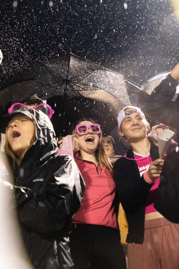 Senior Destiny Deblouw cheers in the rain from the student section during the Texas versus Whitehouse district game. The Texas Tigers were defeated by the Wildcats 32-27, losing the competition for district champs.