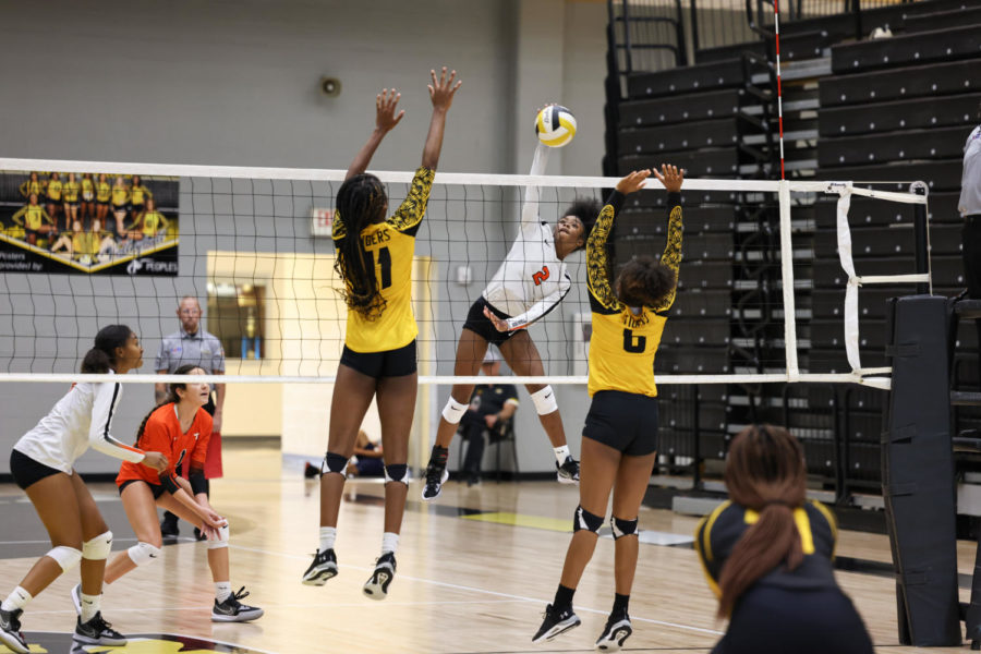 Freshman Kyleigh Perkins  attacks a ball in tight match against Mt. Pleasant Friday, Sept. 30, 2022. Texas won the match 3-2. 