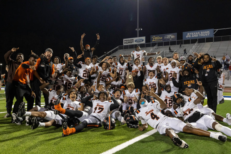 The Tiger football team poses with the district championship trophy after their win over Pine Tree 16-13 Thursday, Nov. 3, 2022. The Tigers will face Terrell in the first round of playoffs at home Friday, Nov. 11, 2022. 