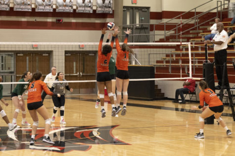 Freshman Taryne Stiger and senior Bella Cherry set up a block in their first round playoff match against Huntsville. The Lady Tigers defeated Huntsville 3-0 and will go on to face Forney in round two Friday, Nov. 4, 2022.
