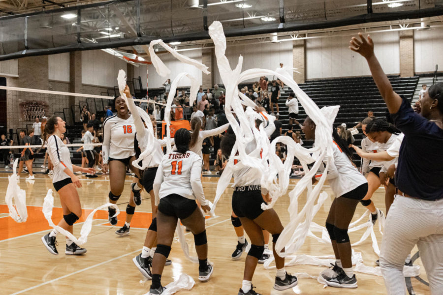 The Lady Tigers throw toilet paper into the air after defeating Pleasant Grove Tuesday, Aug. 23, 2022. The Tigers defeated their rivals 3-1. 