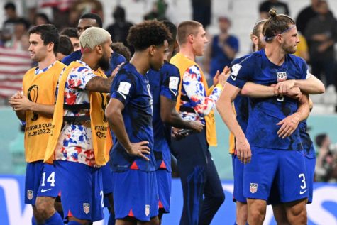 USA teammates celebrate at the end of the Qatar 2022 World Cup Group B football match between Iran and the U.S. at the Al-Thumama Stadium in Doha, Qatar, on Tuesday, Nov. 29, 2022. (Patrick T. Fallon/AFP/Getty Images/TNS)