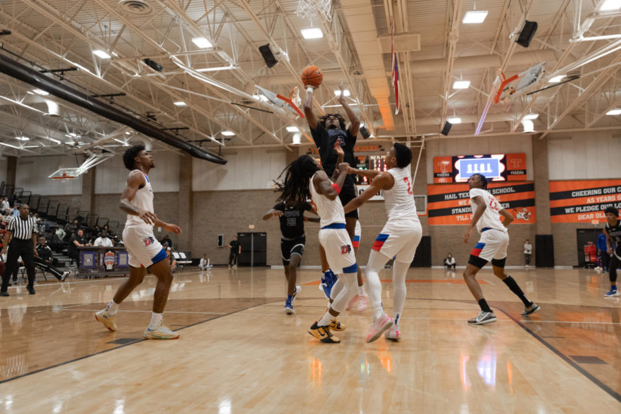 University of Connecticut commit Stephon Castle drives the lane in main event against Duncanville in day two of Hoopfest Saturday, Dec. 3, 2022. Despite Castles 41 point performance, Duncanville took the win 80-76.