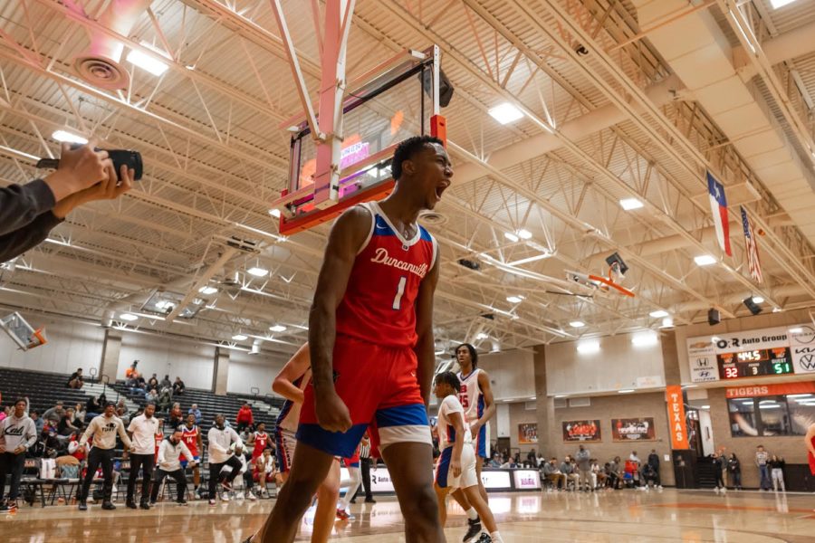 Senior+Ron+Holland+of+Duncanville+celebrates+after+a+fast+break+dunk+in+the+main+event+of+day+one+of+Hoopfest+Friday%2C+Dec.+2.+The+Duncanville+Panthers+defeated+Bartlett+66-51.