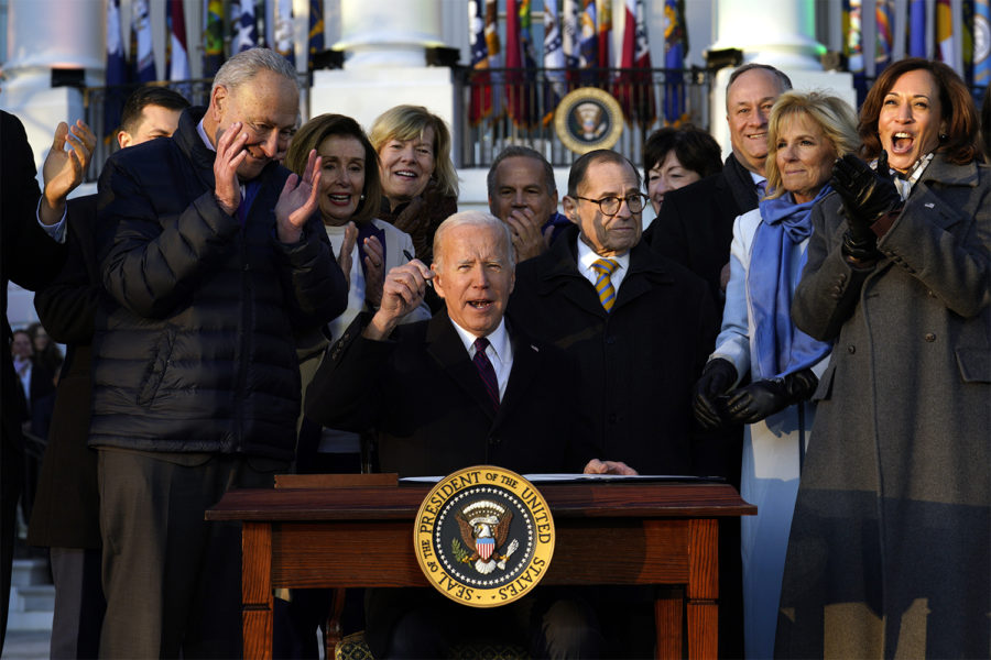 U.S. President Joe Biden signs the Respect for Marriage Act during a ceremony on the South Lawn of the White House in Washington, D.C., on Tuesday, Dec. 13, 2022. (Yuri Gripas/Abaca Press/TNS)