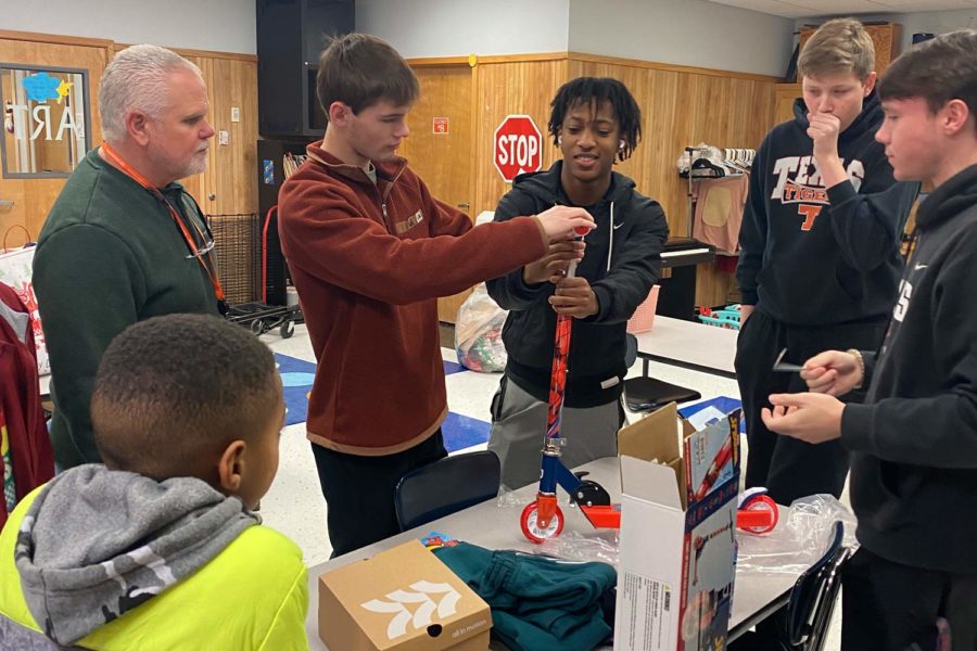 Coach Vince Minter supervised Leadership members assembly of a scooter for a Tiger Angel Gift.
Submitted Photo