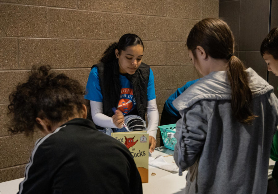 Junior Carrington Grant checks in leaders from the other schools in the district. High school students in the Leader In Me program volunteered to run the event.