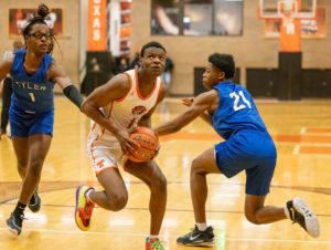 Junior Tamarcus Gray drives the lane in their game against Tyler High Jan. 13, 2023. The game was suspended after an altercation between the two teams later on in the first quarter.