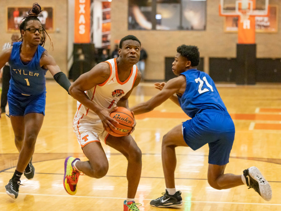 Junior Tamarcus Gray drives the lane in their game against Tyler High Jan. 13, 2023. The game was suspended after an altercation between the two teams later on in the first quarter.