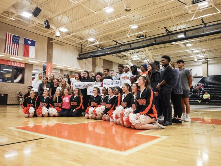 Freshman Julian Lindley Jr. stands with Texas High student council and his family as they celebrate his wish finally being granted. This is moment he will never forget.