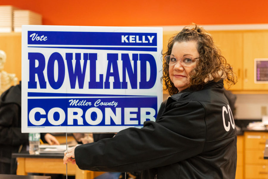 Forensic+Science+teacher+Kelly+Rowland+holds+up+her+campaign+sign+from+when+she+ran+for+coroner.+Rowland+was+elected+the+Miller+County+Coroner.+