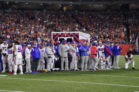 Buffalo Bills players look on after teammate Damar Hamlin (3) collapsed on the field after making a tackle against the Cincinnati Bengals during the first quarter at Paycor Stadium on Monday, Jan. 2, 2023, in Cincinnati. (Dylan Buell/Getty Images/TNS)