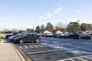 Handicapped parking spots sit empty in the Texas High main student parking lot. The TISD Police Department has begun administering parking tickets with a $600 fine as Tuesday, Feb. 28, 2023.
