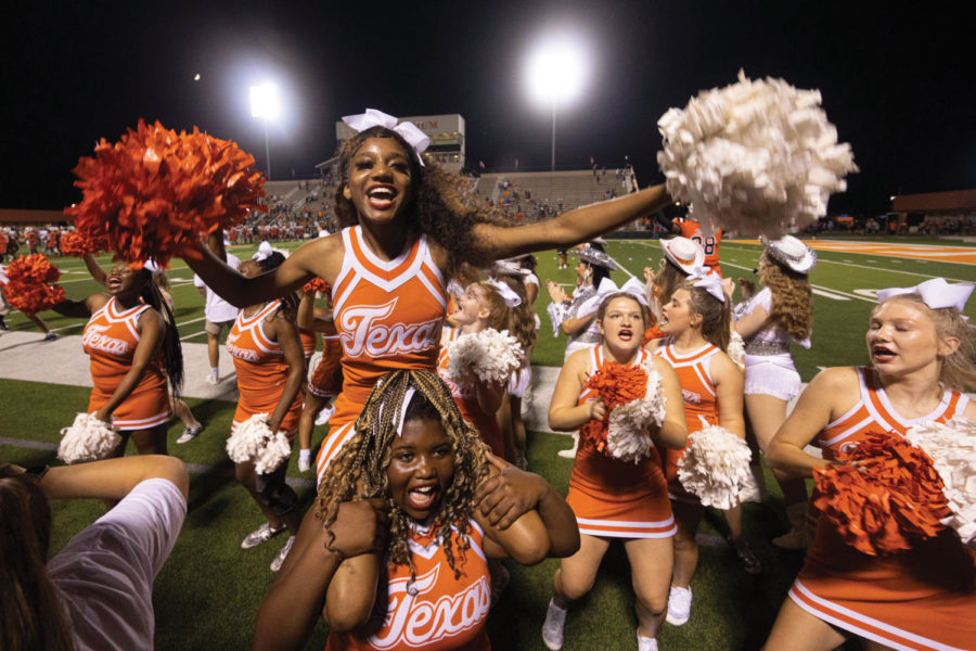 Senior Makenzie Loudermilk cheers after a touchdown is made in a close game. This marks the end of her senior season as a cheerleader.