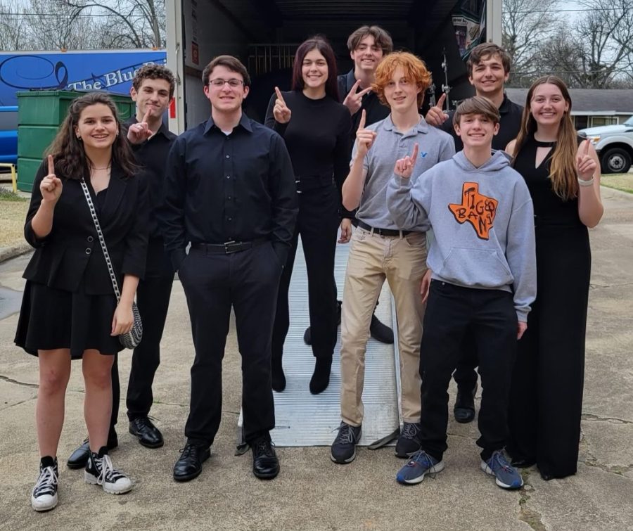 Members+of+the+Tiger+Band+celebrate+moving+on+at+State.+They+competed+in+both+the+solo+and+ensemble+portions+of+the+competition.