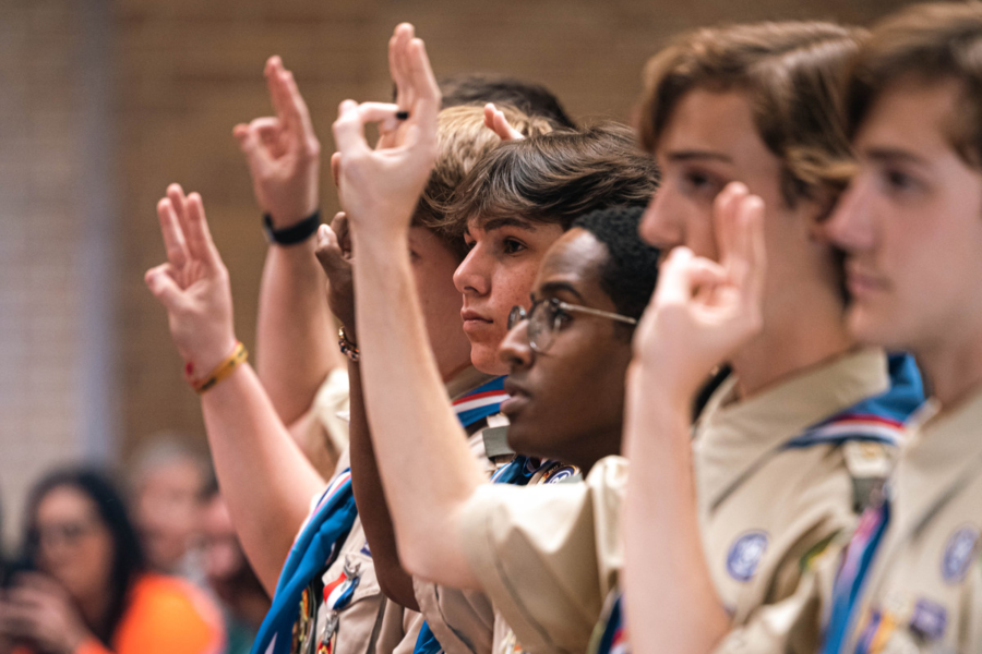 Seniors receiving their Eagle Scout award hold up their hands in the Boy Scout pledge. Its an honor for scouts to receive this award after all of their years of membership.