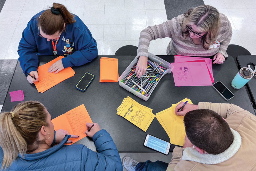 The teachers write notes to students as they make birthday cards for students using colored pencils, markers and even stickers. Teachers sign up to give out 10 birthday cards every 2-3 months.