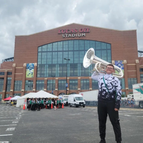 Senior Cayden “CJ” Jordan holds his tuba in front of Lucas Oil Stadium before marching with the Guardians. DCI Finals are held in Indianapolis, IN, and the Guardians placed 5th place, the highest rank they have ever recieved. 