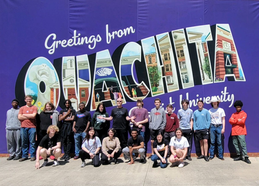 Band students stand alongside their directors in front of a mural on their trip to OBU. Students spent their time learning new skills such as identifying certain pitches.