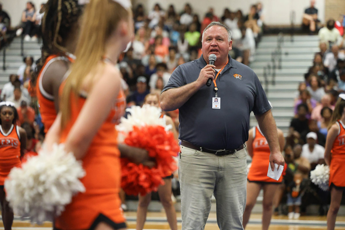 Introducing+himself+at+the+first+pep+rally+of+the+school+year%2C+new+Texas+High+principal+Ben+Renner+addresses+the+community.+Renner+previously+served+as+the+Cleburne+High+School+principal.+Students+gathered+in+the+Tiger+Center+for+the+annual+back+to+school+event+on+August+14%2C+2023.+