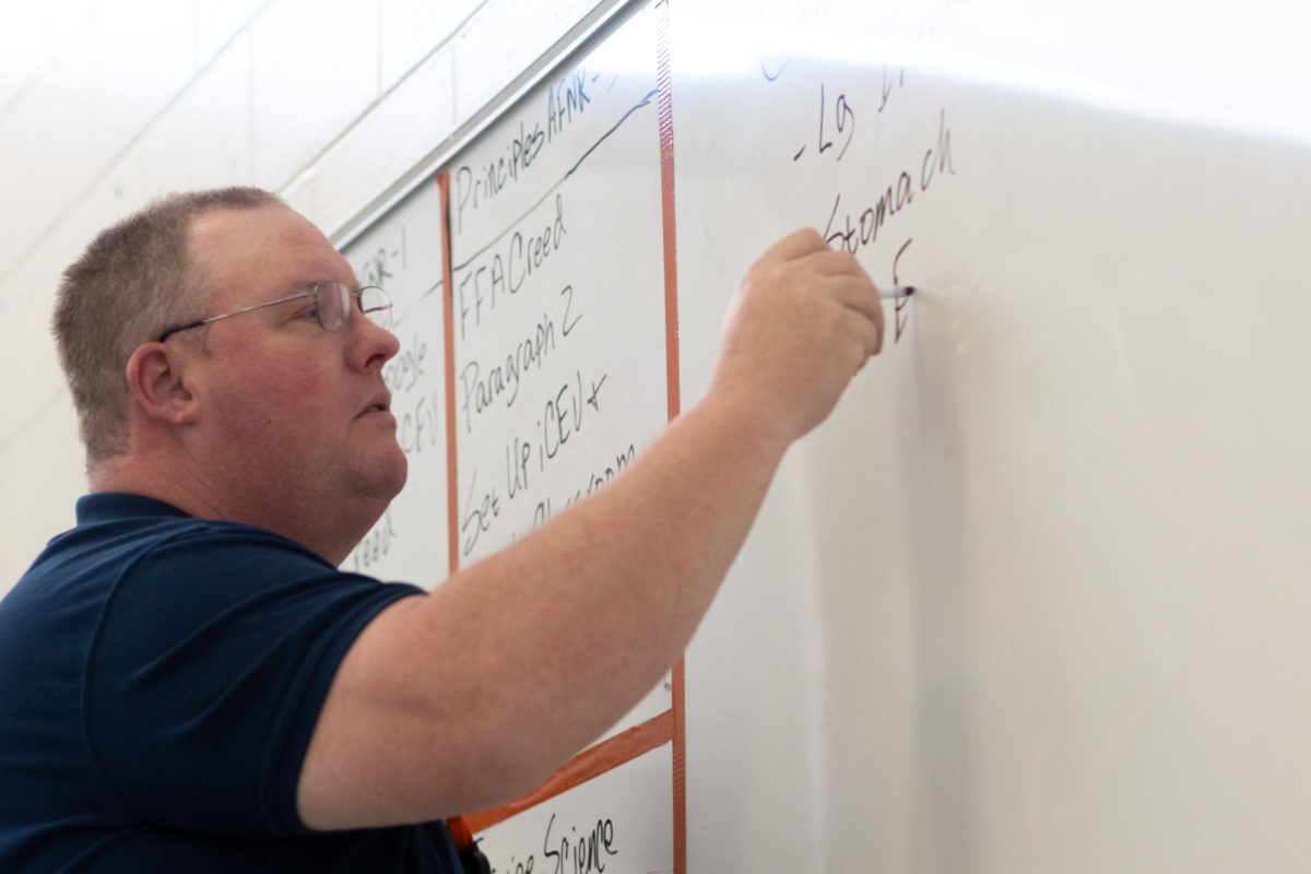 New to THS agriculture teacher James Skelton writes on a whiteboard as he teaches class. Skelton teaches several classes such as equine science, small animal management and principles of agriculture, food and natural resources. 