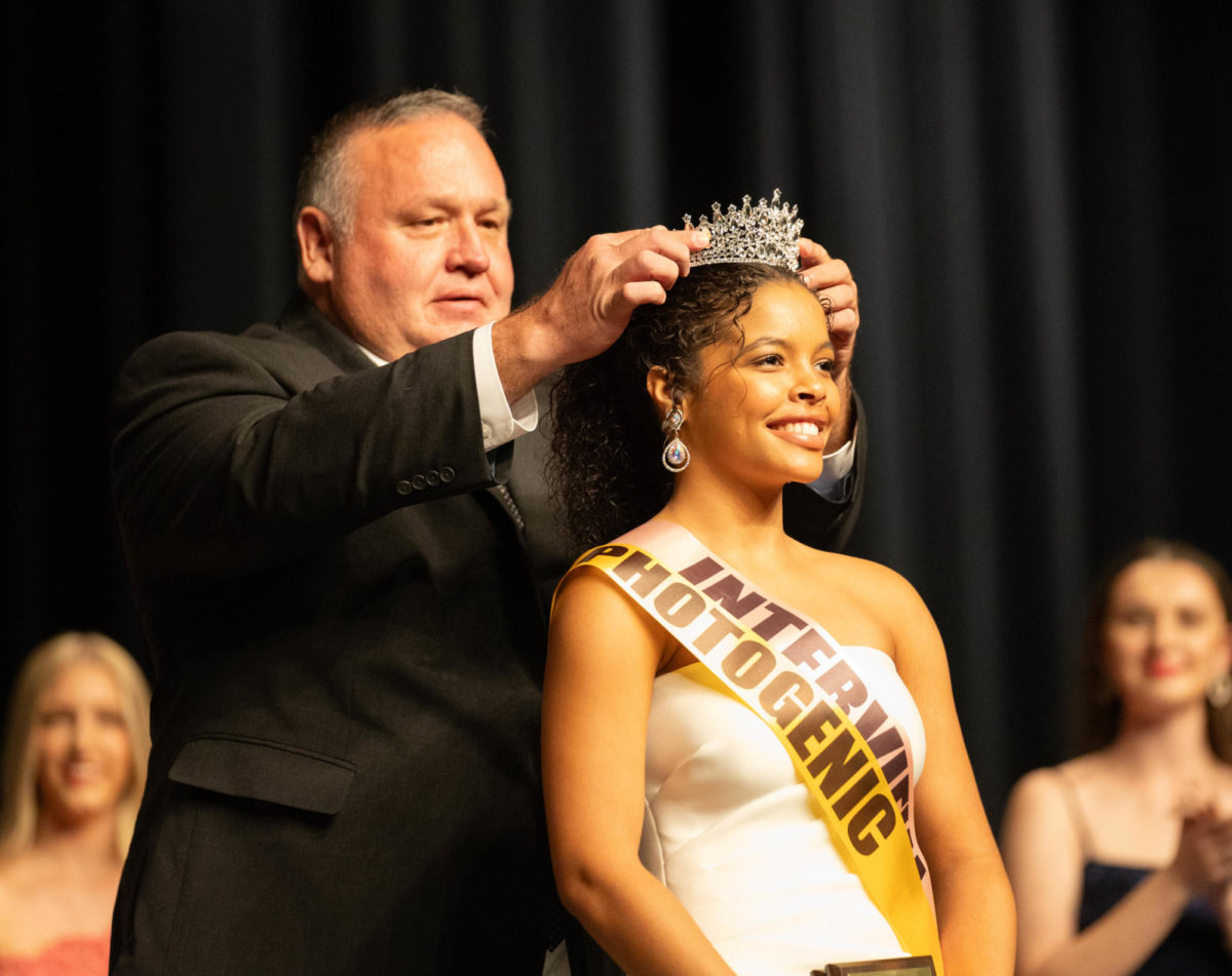 Texas High School principal Ben Renner places the Miss THS crown on senior Cassidy Grant on Sept. 9, 2023 in the Sullivan Performing Arts Center. Former Miss THS and Miss Texas Stacy Mayo helped to revive the scholarship pageant after a multi-year absence.
