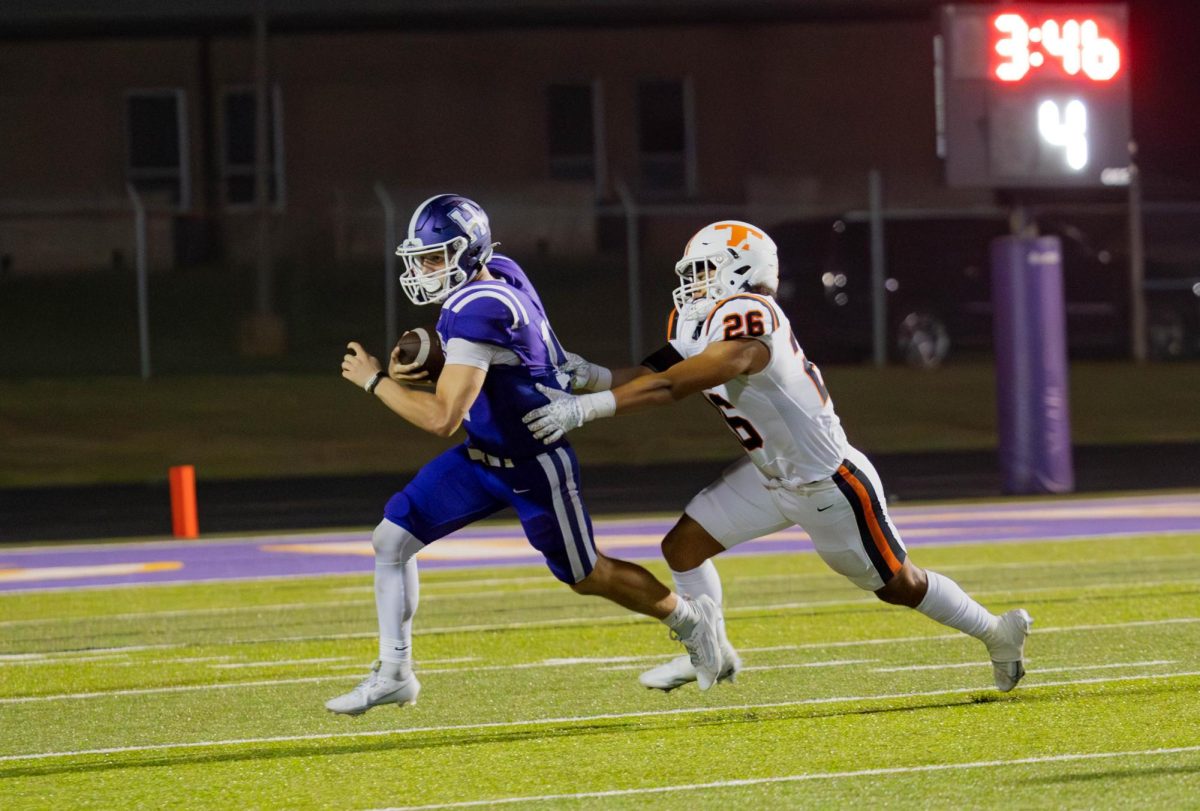 Senior Trystan Powell lunges for a tackle in a district game against the Hallsville Bobcats Friday, Sept. 22, 2023. The Tigers defeated the Bobcats with a final score of 42-7.